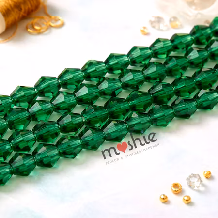 Fasetterad kristallimitation av glas Bicone emerald 4mm 85st