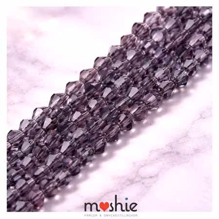 Fasetterad kristallimitation av glas Bicone purple 4mm 85st