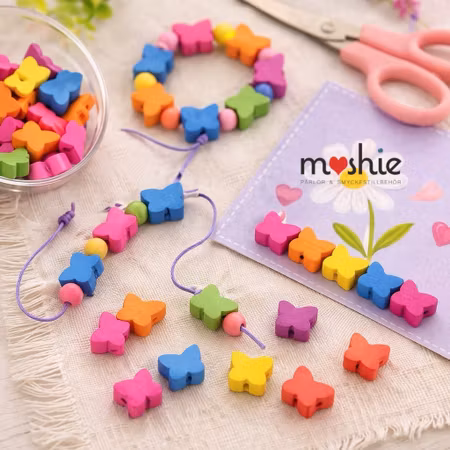 Fjärilar av trä i färgglada färger 16mm 50st