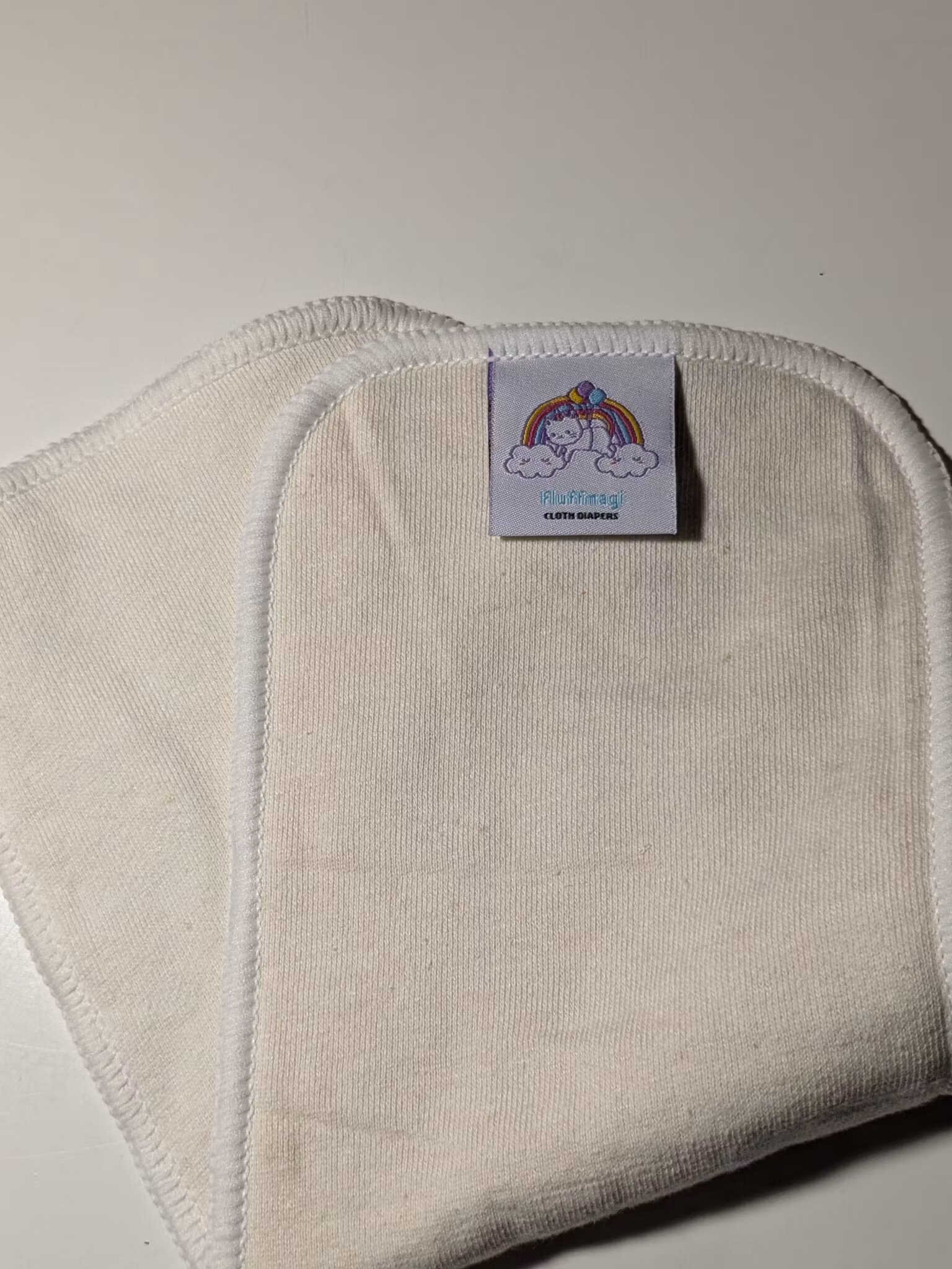 Fluffmagis, stort hampa inlägg, trasig söm