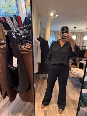 Glittrig skjortblus svart