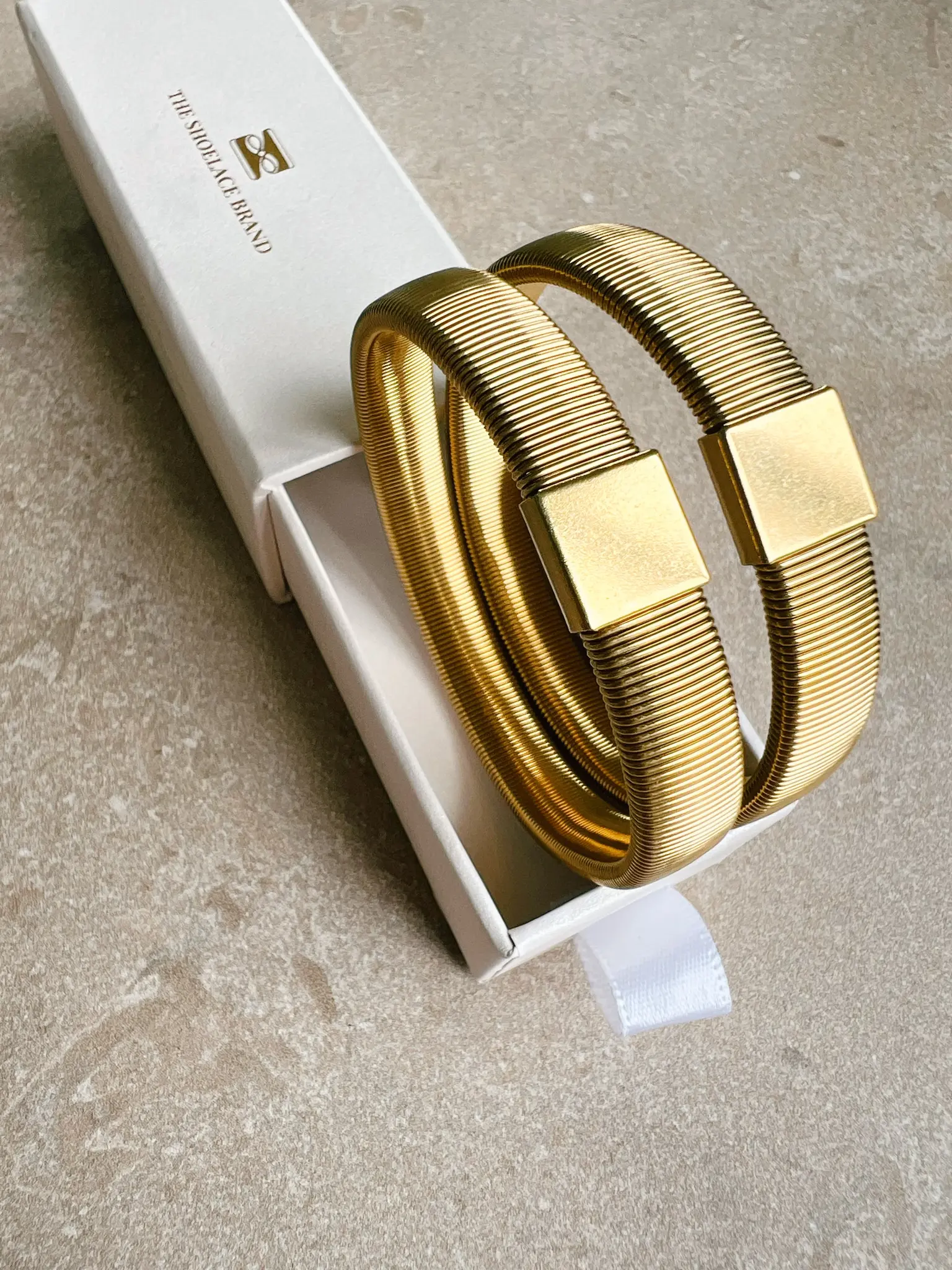 Ärmhållare guld