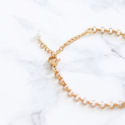 Tunt Armband Med Rosa Tofs - Pelikanen P