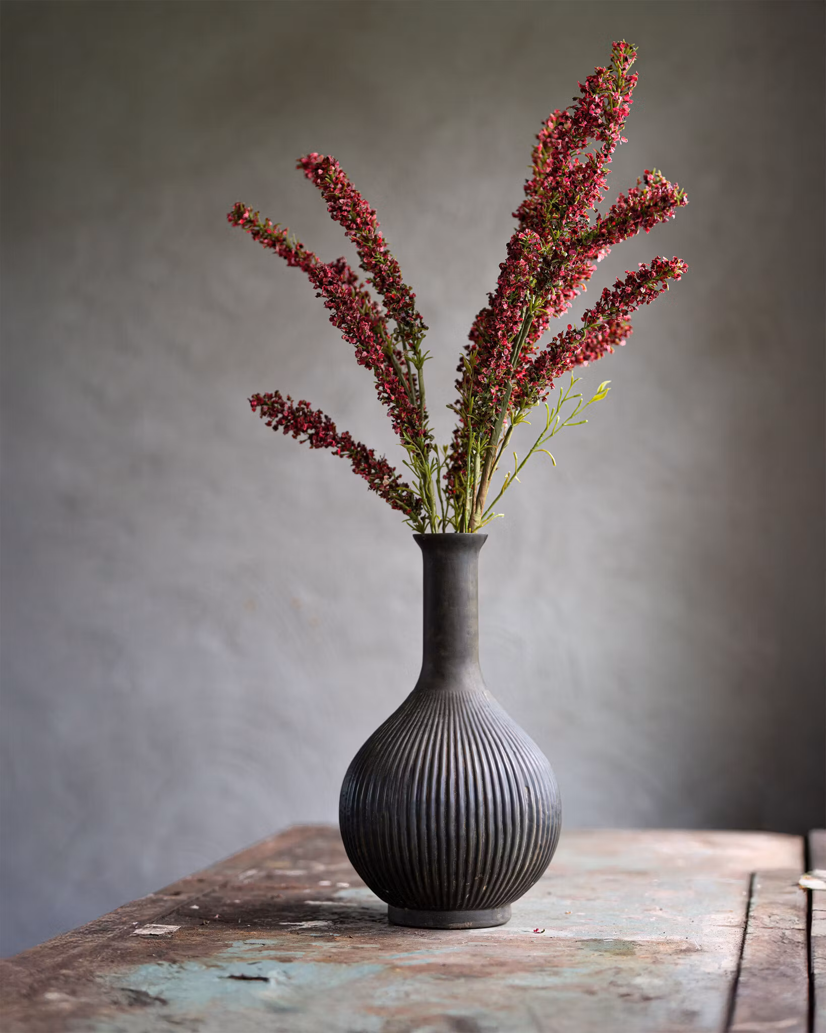 Gren med røde blomster