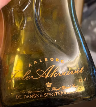 Glasflaske Aalborg Jule Akvavit – grøn med korkprop, tom