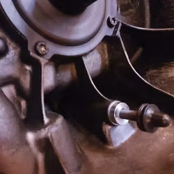 Adjusting device for mechanical clutch release bearings