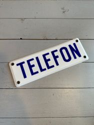 Skylt telefon