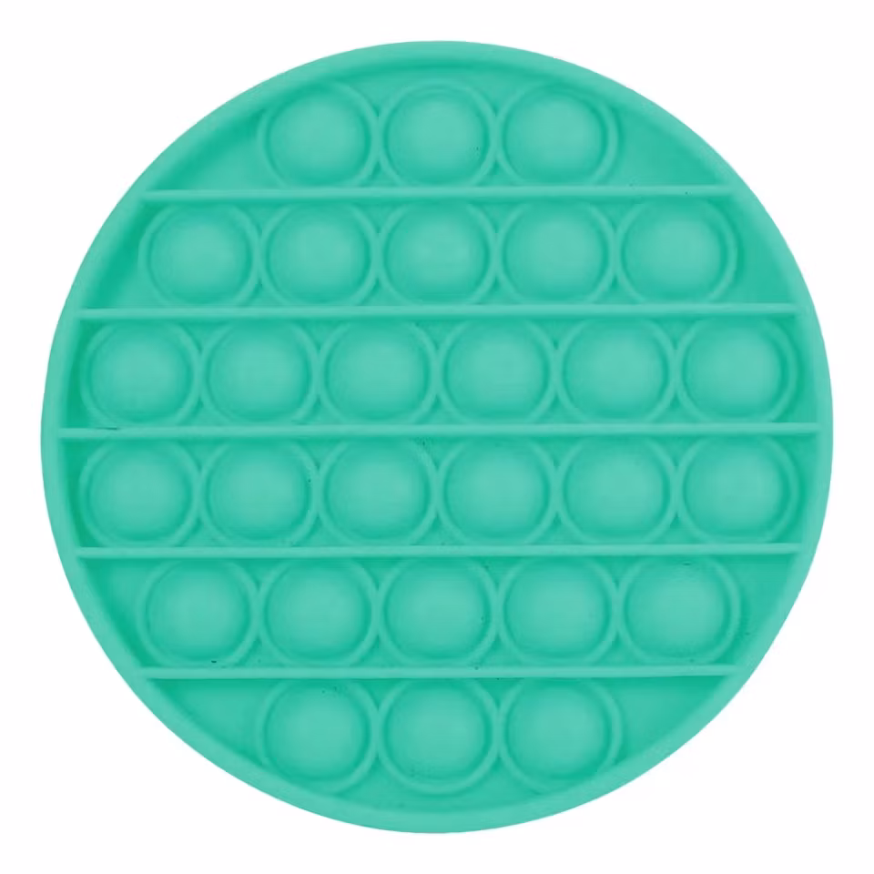 Rund Pop It Fidget Toy i ljusgrönt silikon – stressleksak med bubblor som poppas för ökat fokus och lugn.