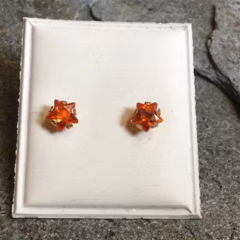 Guldörhängen med orange syntetisk sten