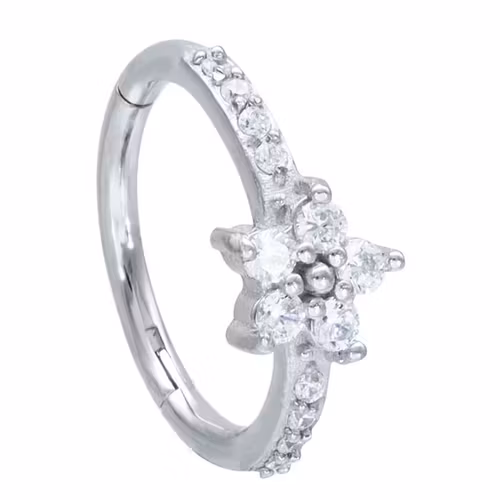 Vacker ring med vita stenar och en blomma 1,2x12 mm