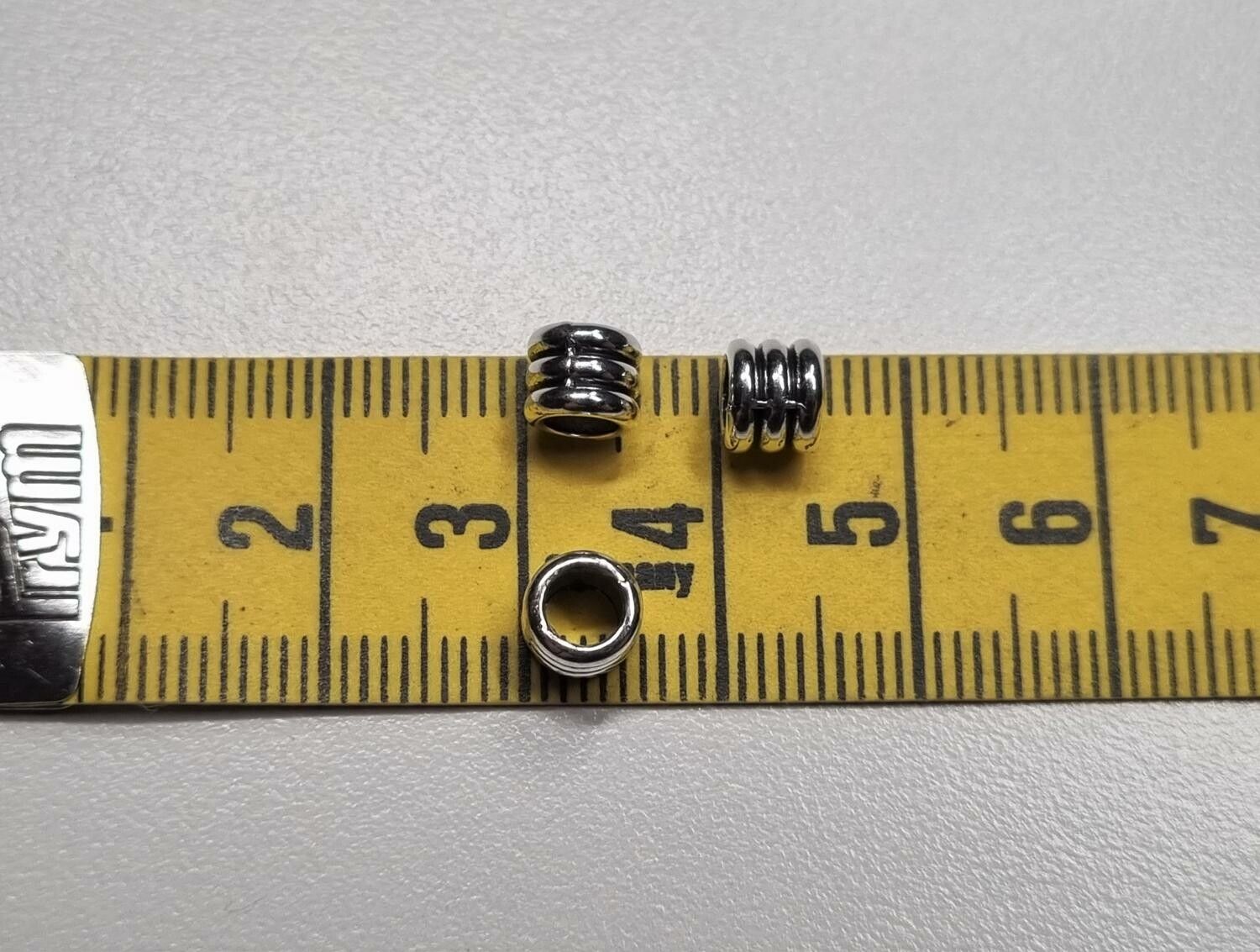20 silverfärgade spacer beads i metall (6x6 mm)