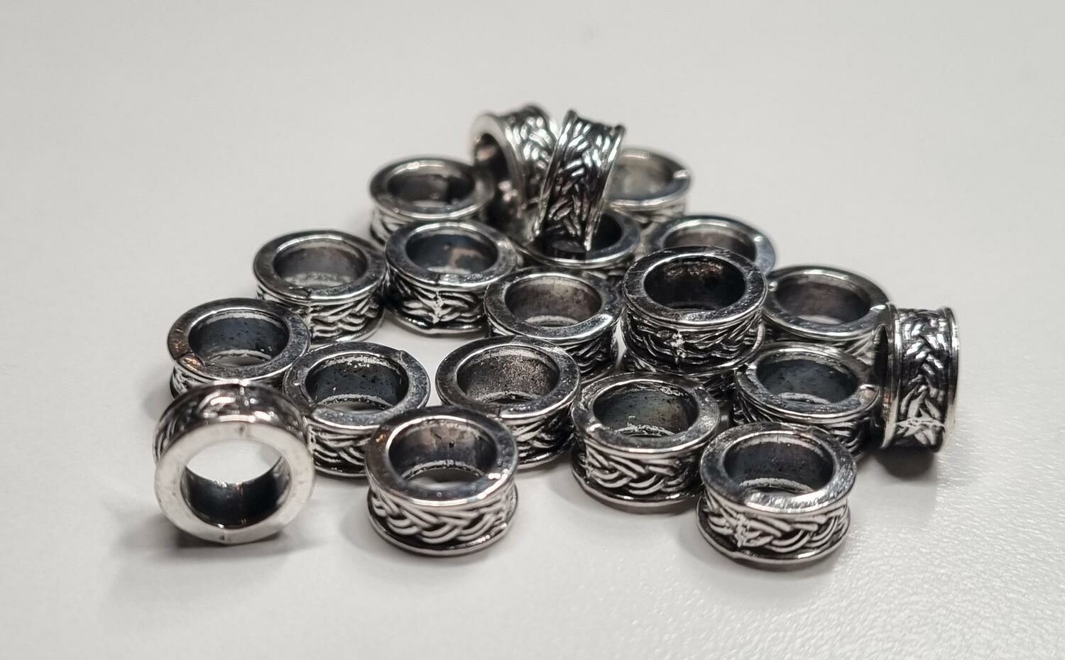20 silverfärgade spacer beads i metall (9x4 mm)
