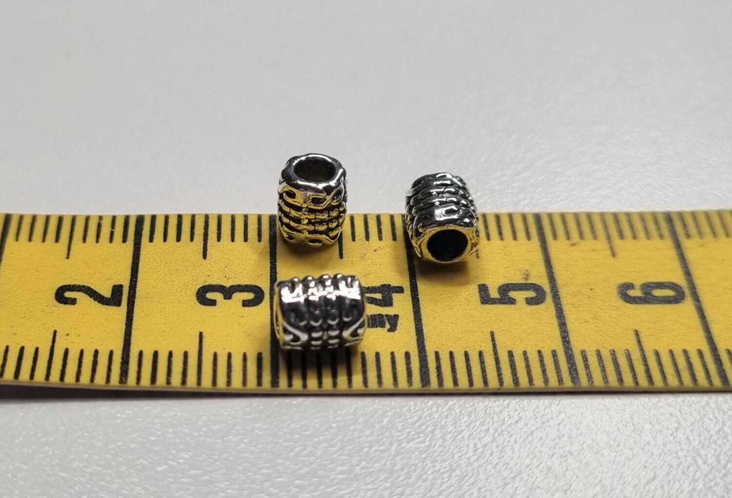 20 silverfärgade spacer beads i metall (5x6 mm)