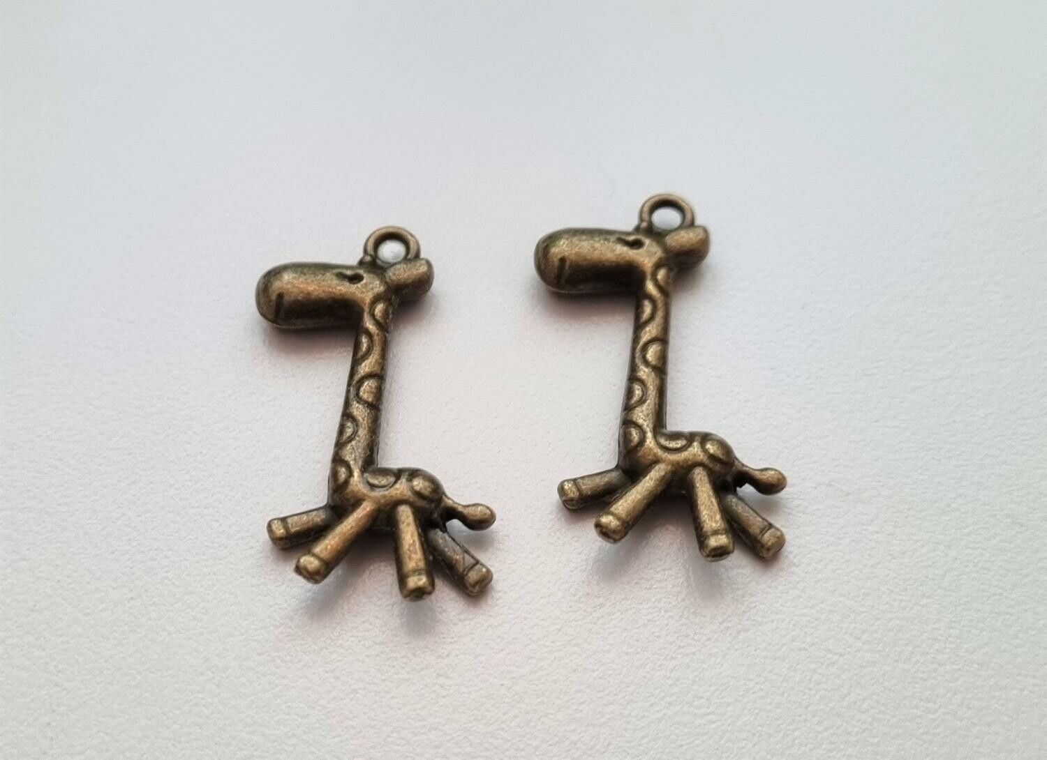 2 st bronsfärgade Giraffer, berlocker, charms