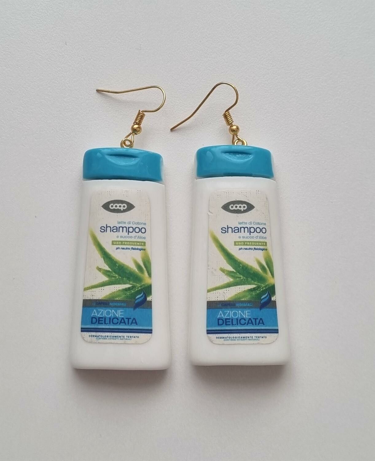Ett par örhängen, Shampoo / duschcreme (32,5 gram)