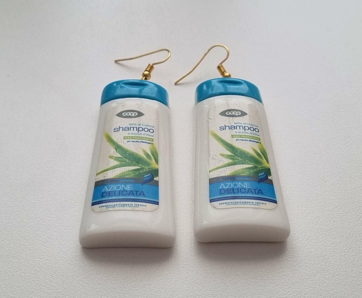 Ett par örhängen, Shampoo / duschcreme (32,5 gram)