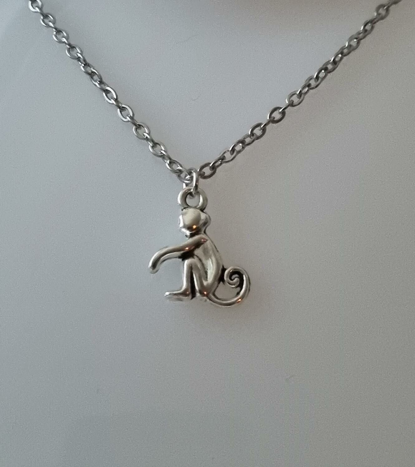Halsband med en apa, apberlock / charm