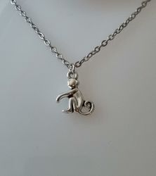 Halsband med en apa, apberlock / charm