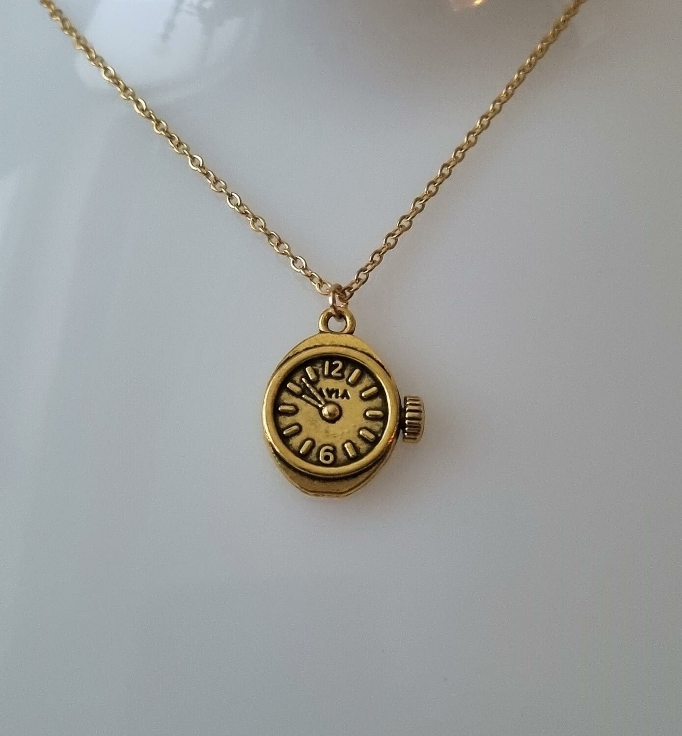 Halsband med klockberlock i steampunk (50 cm långt halsband)