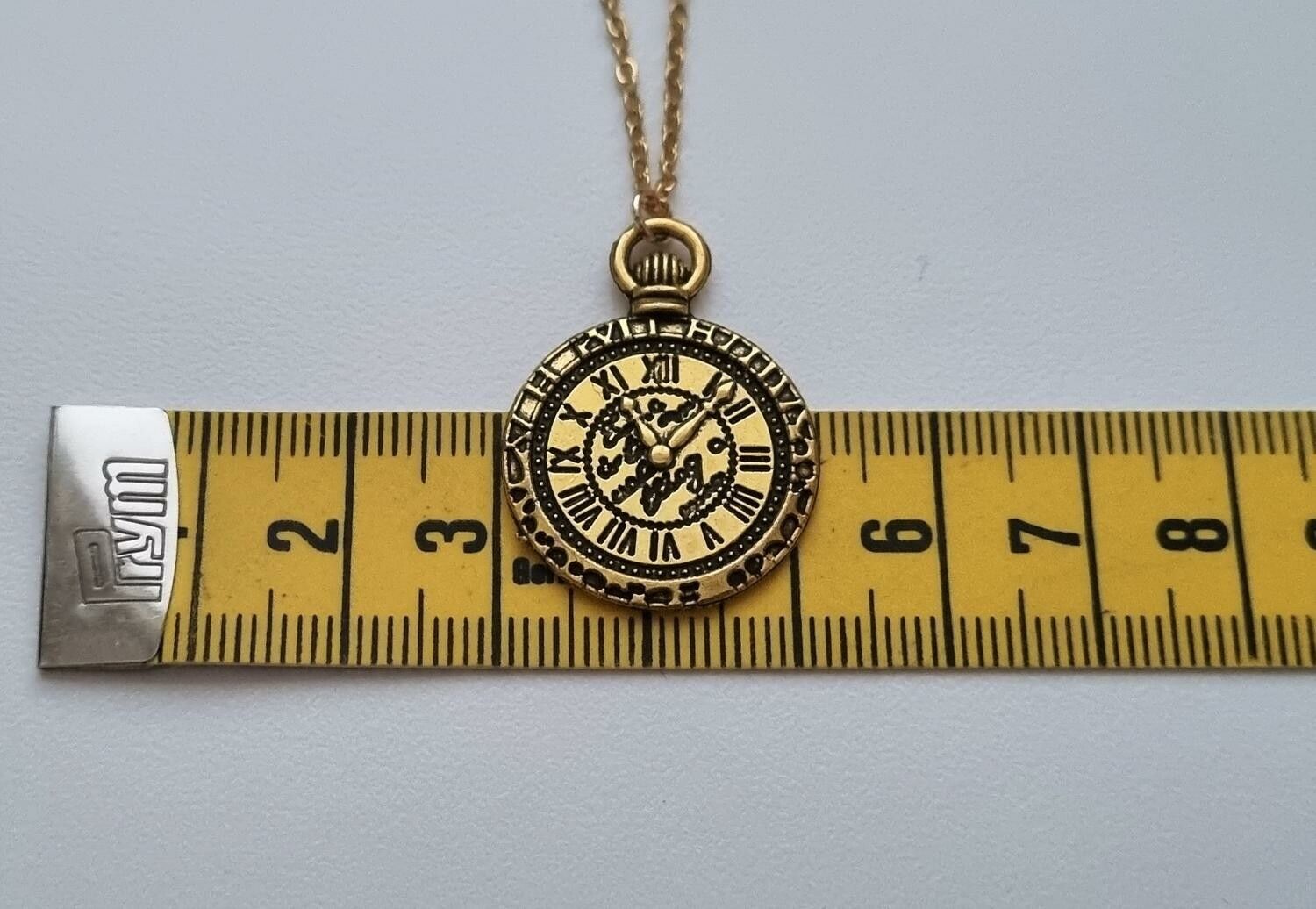 Halsband med klockberlock i steampunk (45-50 cm långt halsband)