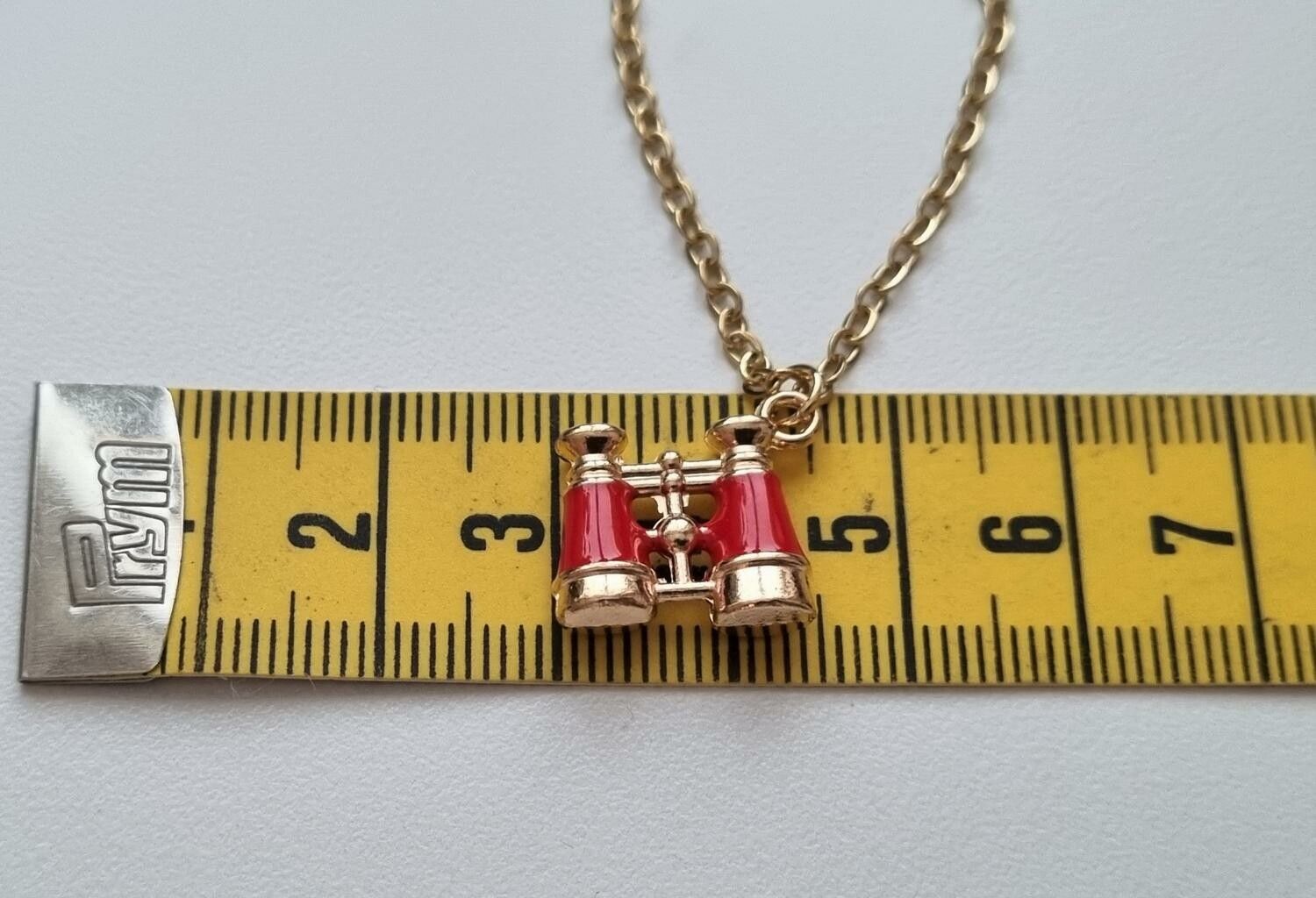 Guldfärgat halsband med kikare, kikarberlocker / charm