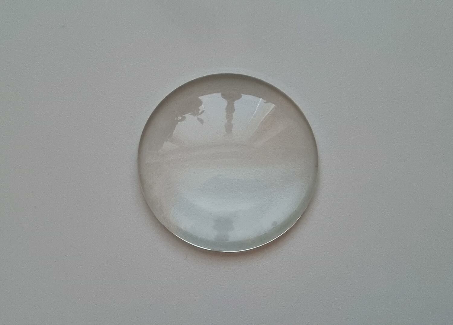 1 stor transparent cabochon i glas, glasinfattning (50 mm)