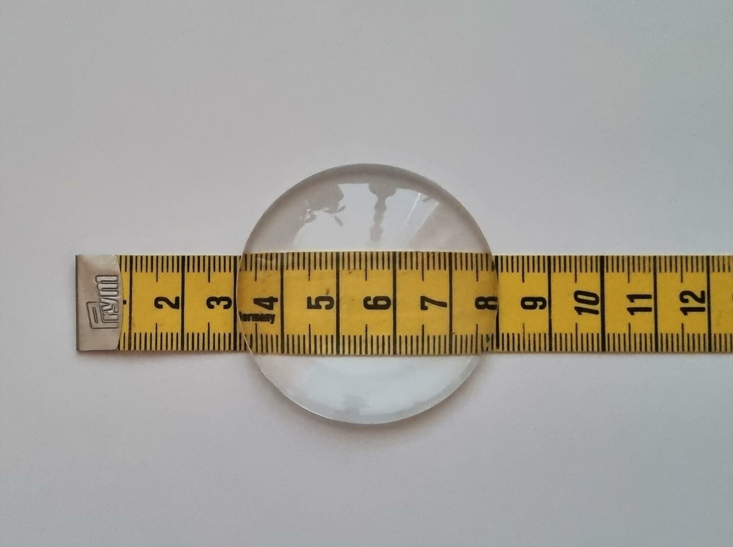 1 stor transparent cabochon i glas, glasinfattning (50 mm)