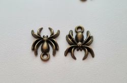 2 st Spindlar berlocker / charms (bronsfärgade)