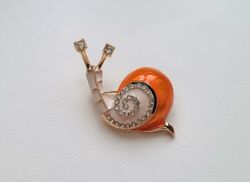 Brosch, gullig liten orange snigel