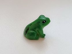 1 st grön liten groda. Miniatyr / figurin för dekoration