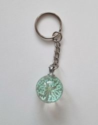 Nyckelring Glaskula glasboll med torkad blomma (turkos)