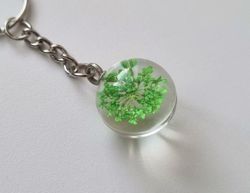 Nyckelring Glaskula glasboll med torkad blomma (grön)