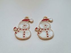 2 st snögubbar. Hängen / berlocker / charms till jul
