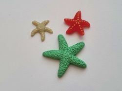 3 st sjöstjärnor i resin. Miniatyrer / figuriner för dockskåpet, tittskåp mm