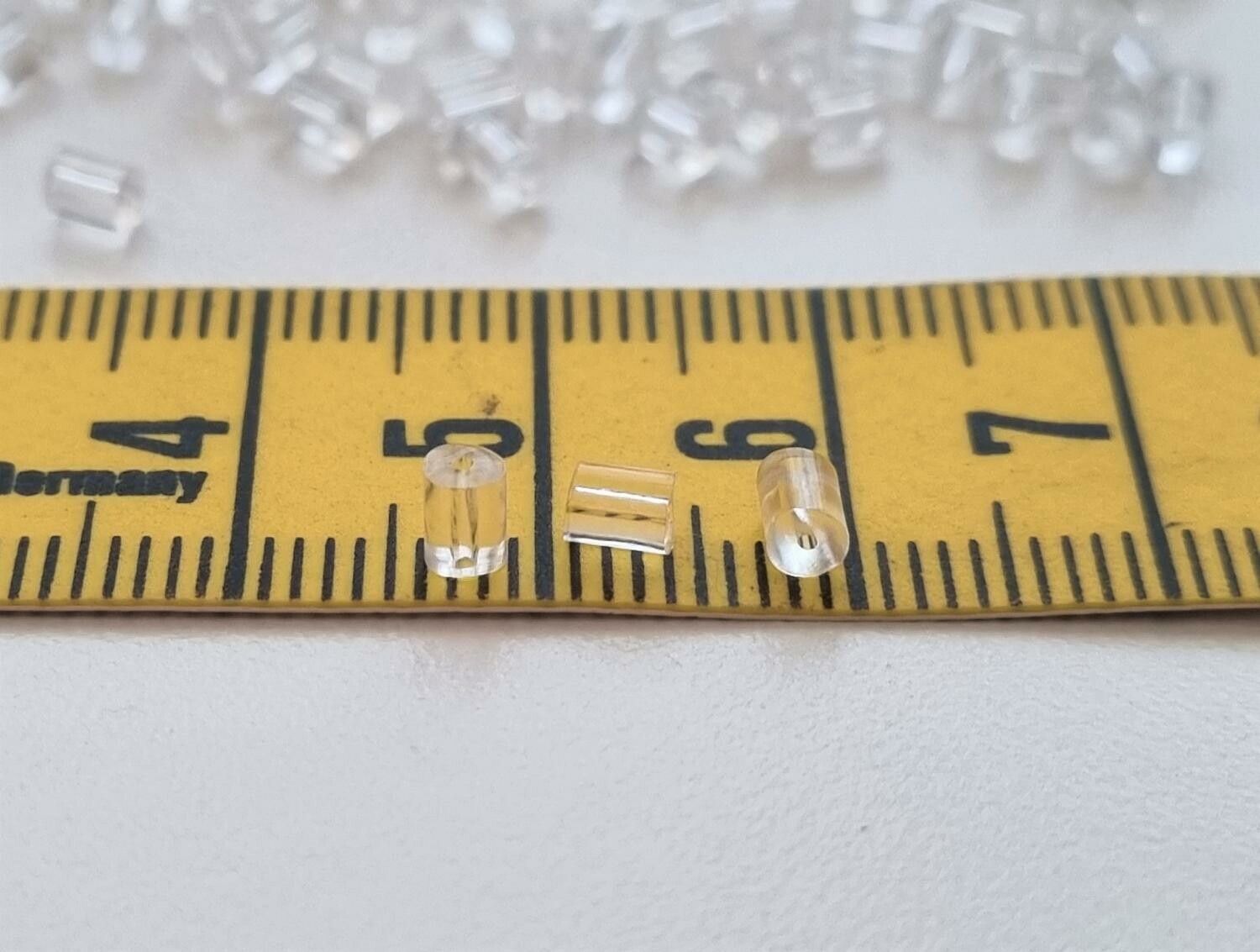 50 st pluppar bakstycken stoppers för örhängen (cylinderformade)