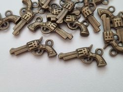 2 st pistoler, berlocker / charms för smyckestillverkning (bronsfärgade)