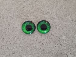2 st drakögon kattögon i glas, glasinfattningar, cabochoner (12 mm)