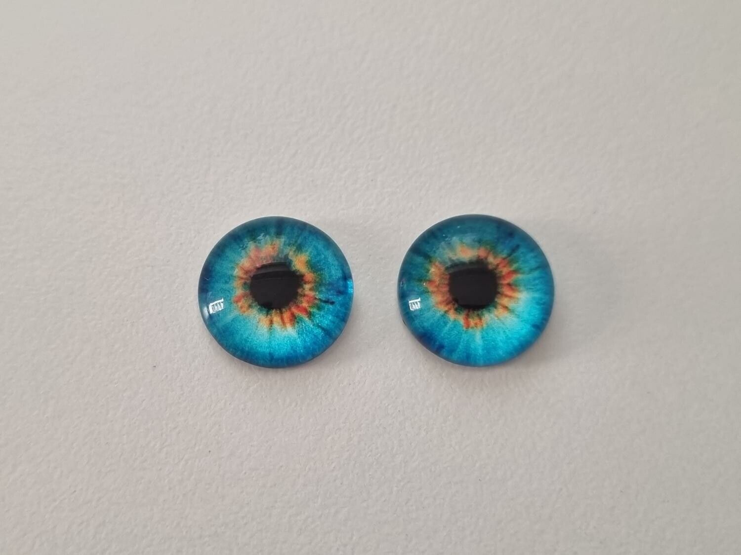 2 st drakögon kattögon i glas, glasinfattningar, cabochoner (12 mm)