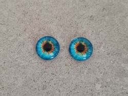 2 st drakögon kattögon i glas, glasinfattningar, cabochoner (12 mm)