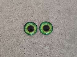 2 st drakögon kattögon i glas, glasinfattningar, cabochoner (12 mm)