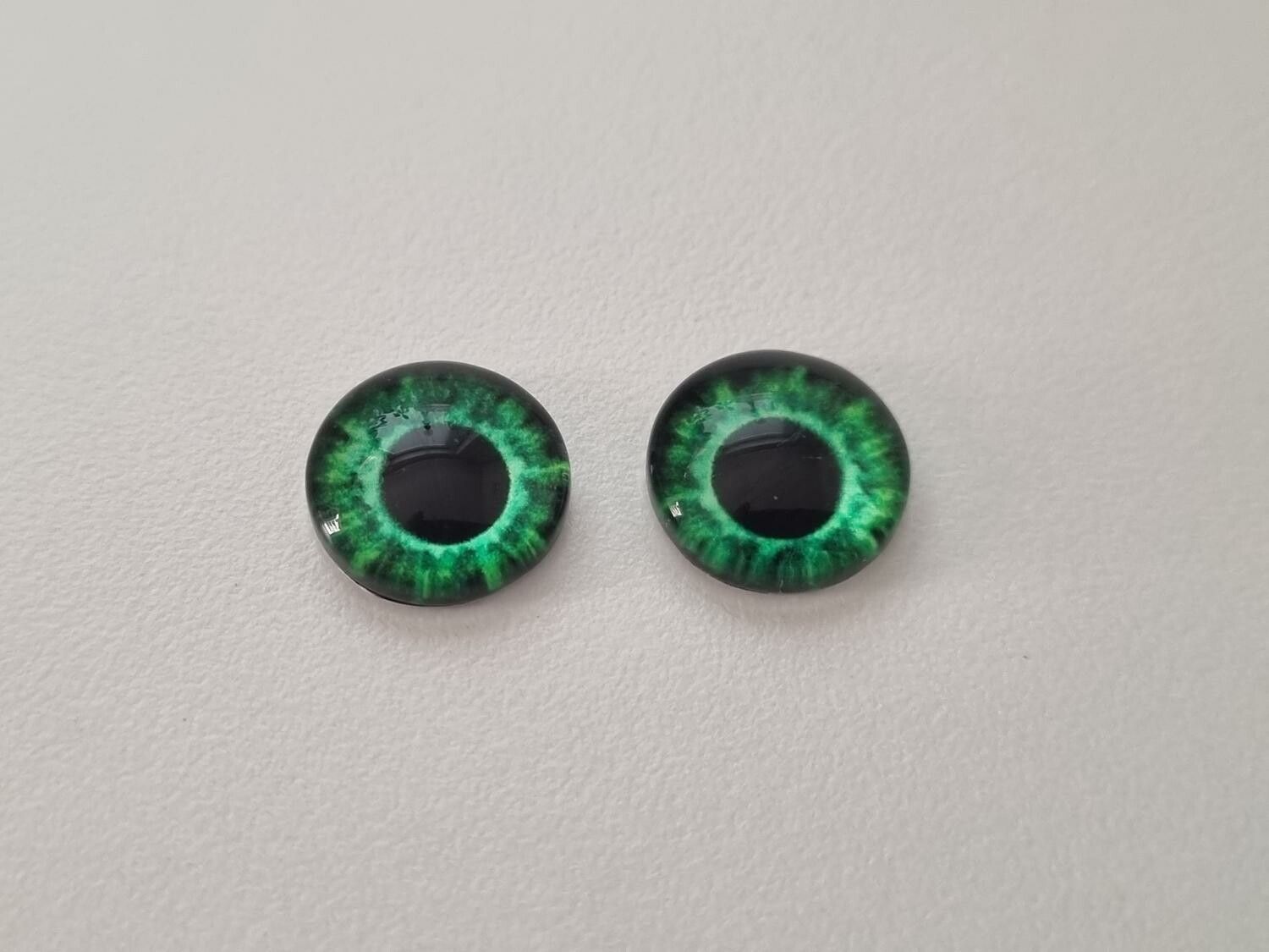 2 st drakögon kattögon i glas, glasinfattningar, cabochoner (12 mm)