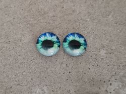 2 st drakögon kattögon i glas, glasinfattningar, cabochoner (12 mm)