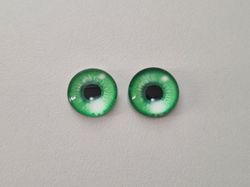 2 st drakögon kattögon i glas, glasinfattningar, cabochoner (12 mm)