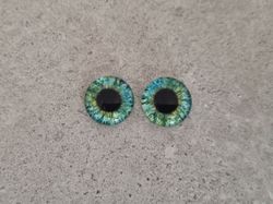 2 st drakögon kattögon i glas, glasinfattningar, cabochoner (12 mm)