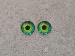 2 st drakögon kattögon i glas, glasinfattningar, cabochoner (12 mm)