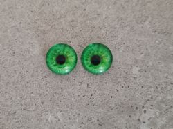 2 st drakögon kattögon i glas, glasinfattningar, cabochoner (12 mm)