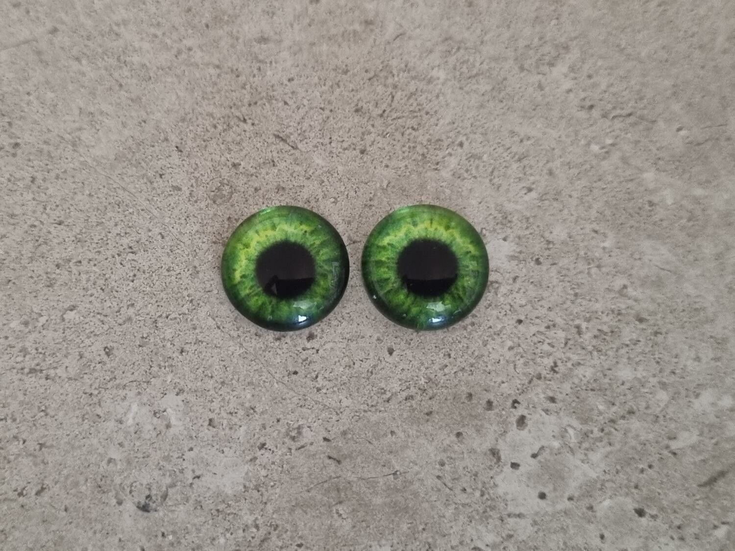 2 st drakögon kattögon i glas, glasinfattningar, cabochoner (12 mm)
