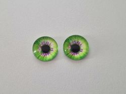 2 st drakögon kattögon i glas, glasinfattningar, cabochoner (12 mm)