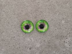 2 st drakögon kattögon i glas, glasinfattningar, cabochoner (12 mm)