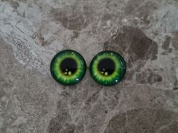 2 st drakögon kattögon i glas, glasinfattningar, cabochoner (12 mm)